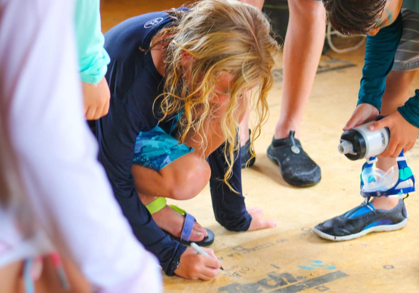 camper signs floor of new Kennedy building